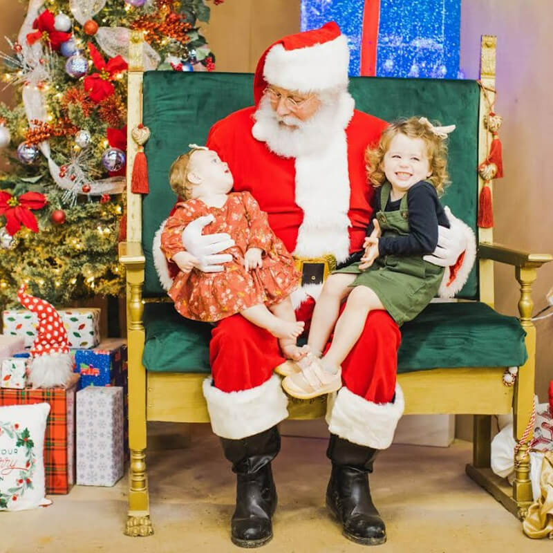 Santa With Two Young Kids on His Lap